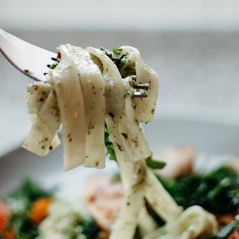 Pistachio pesto tossed with pasta, ready for a bite on the fork — Tutto Sicilia